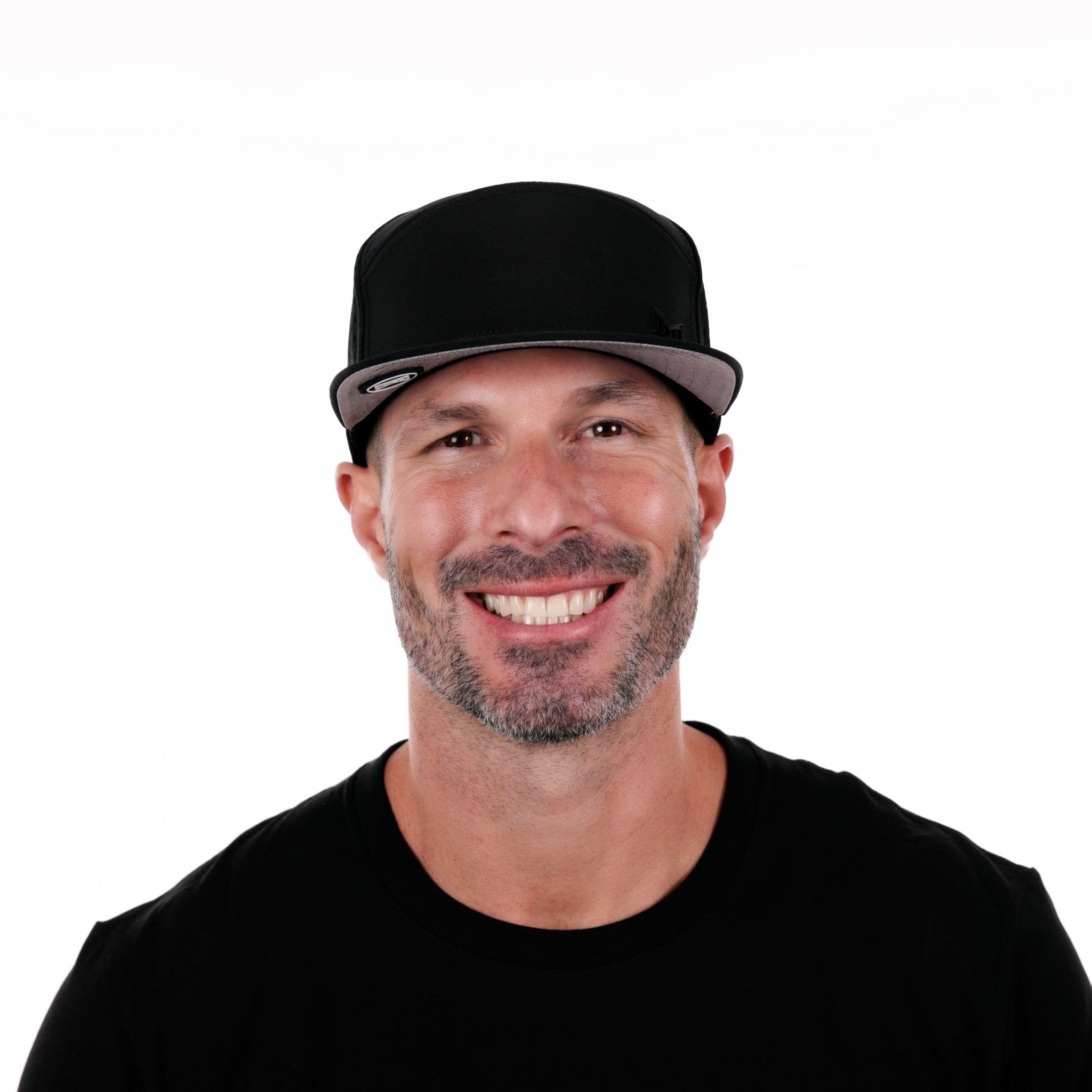 The model-image of the Melin Horizon Fit Trenches Icon Hydro hat in Black