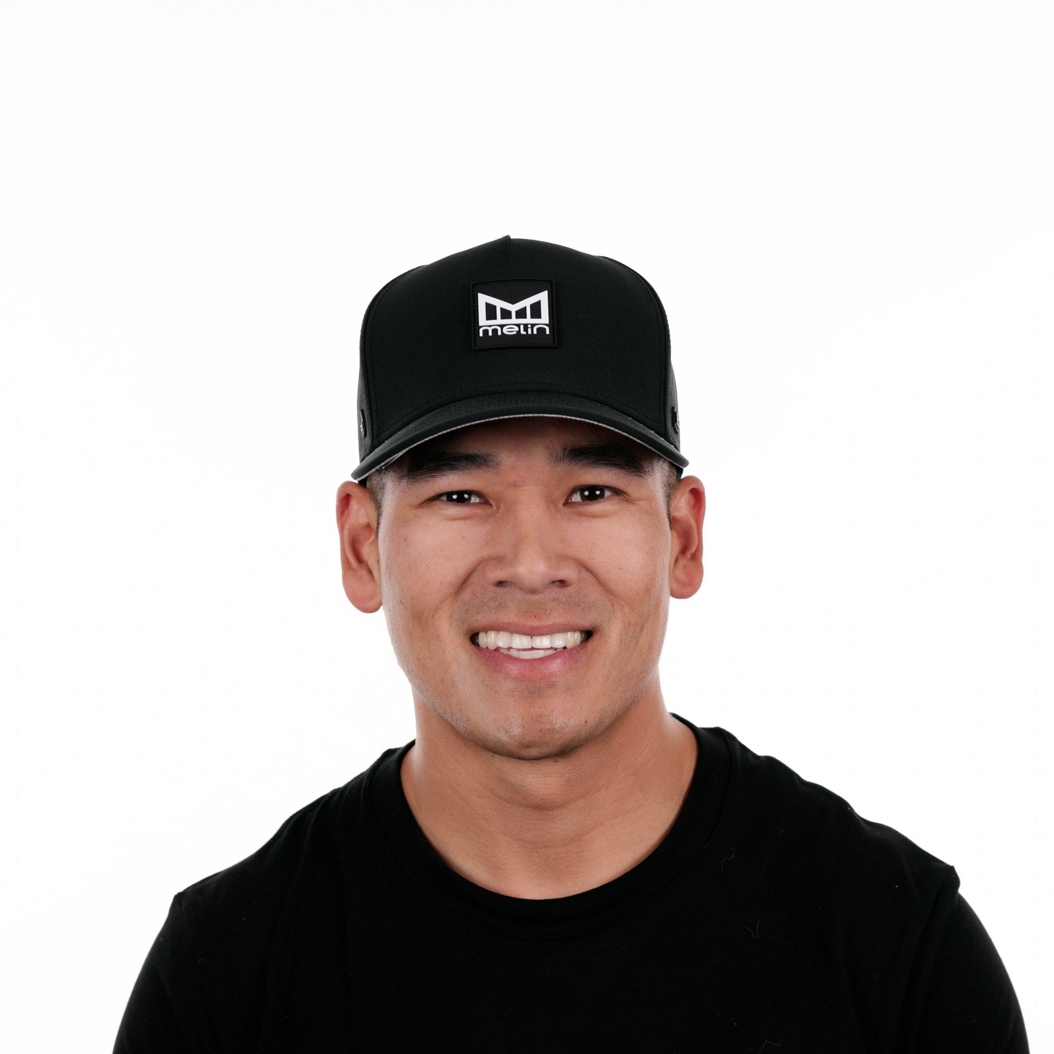 The model-image view of the Melin Split Fit Odyssey Stacked Hydro hat in Black