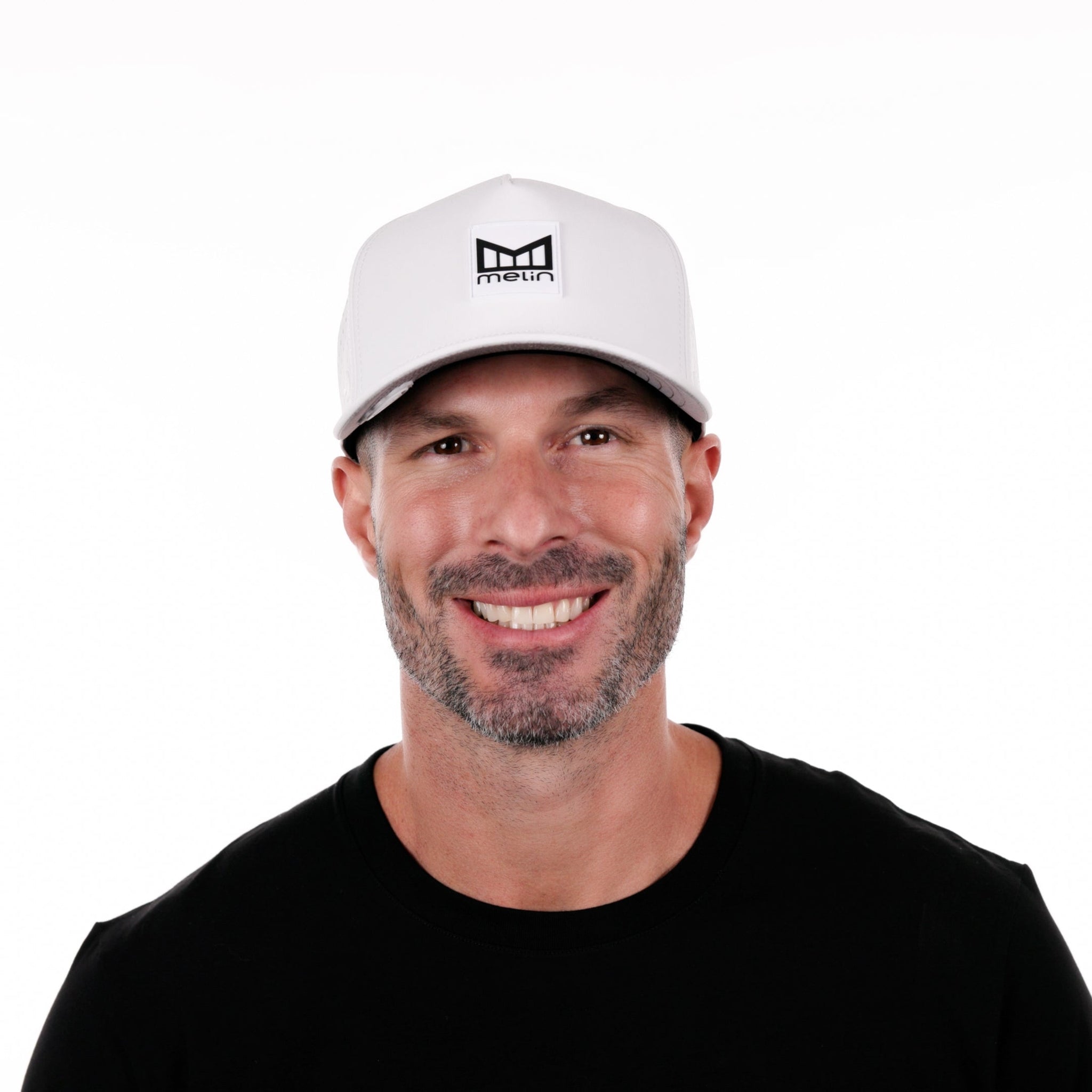The model-image of the Melin Split Fit Odyssey Stacked Hydro hat in white