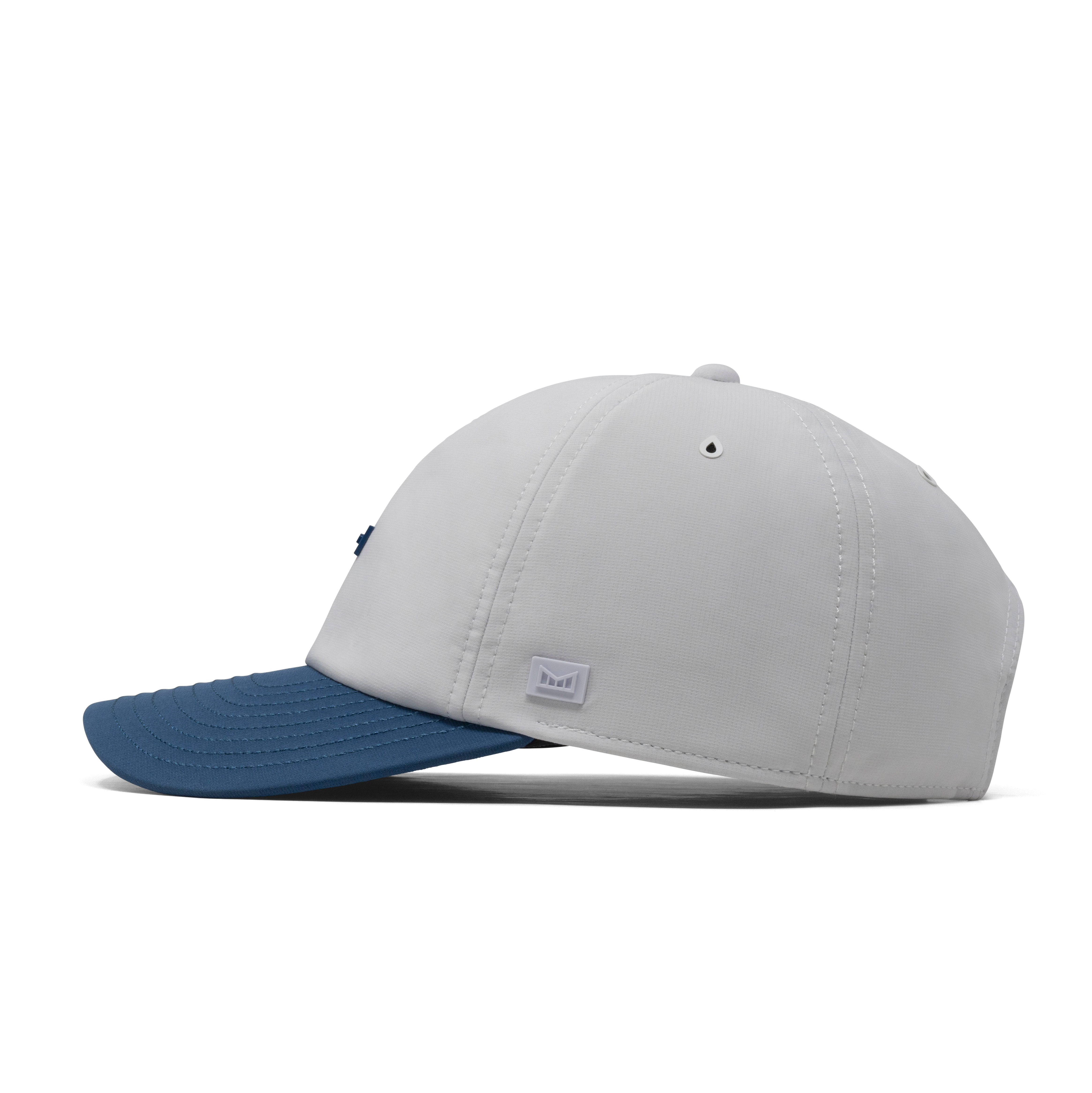 The side view of the melin The Legend Hydro  Performance Dad Hat in  Steel Blue / White
