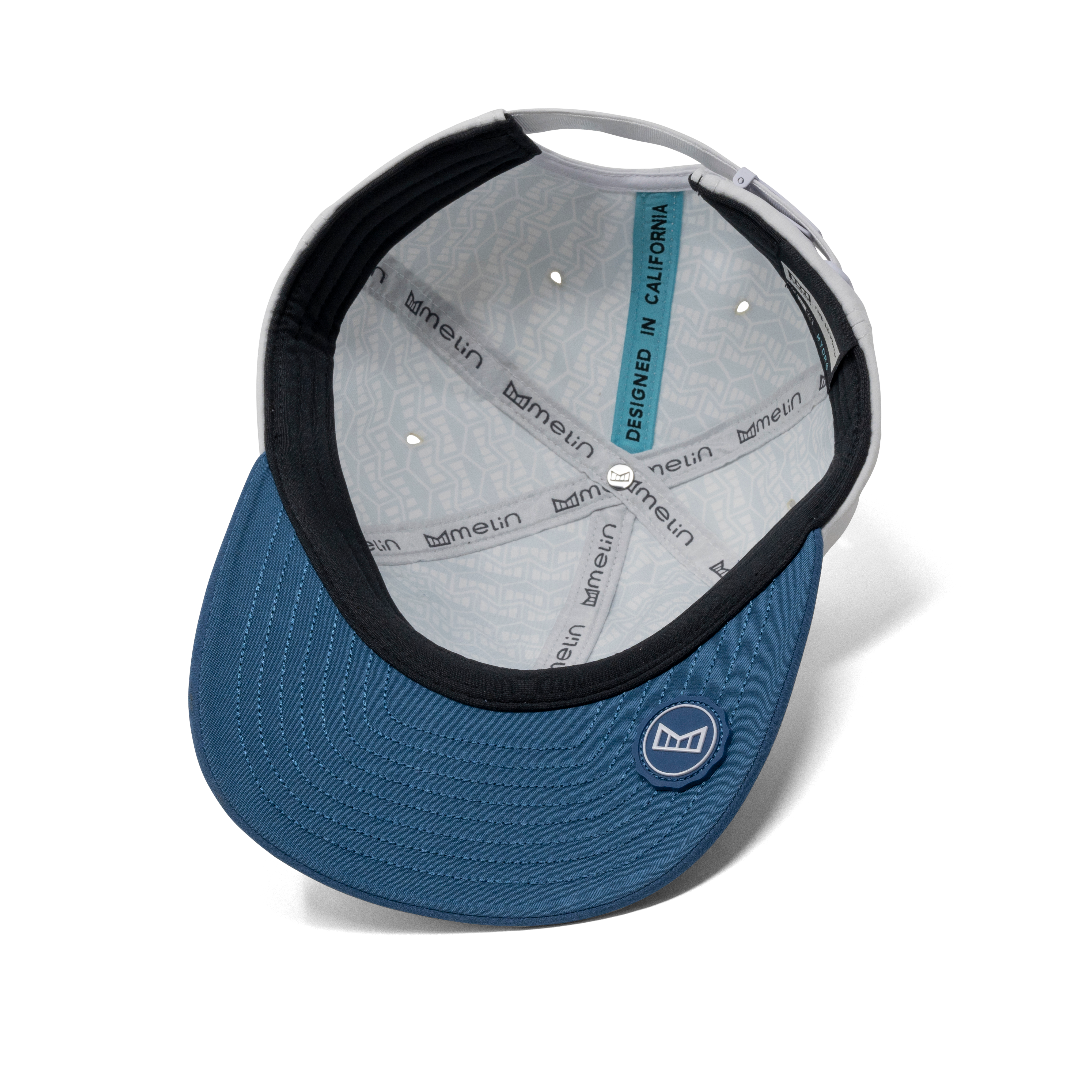 The inside view of the melin The Legend Hydro  Performance Dad Hat in  Steel Blue / White